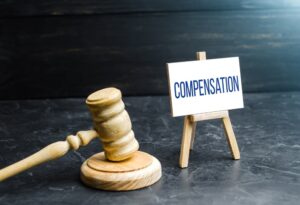  A judge's gavel and compensation: awarding moral and financial damages.