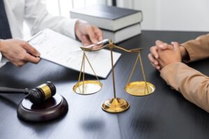 A lawyer or judge presenting a client with contract documents, symbolizing law and legal services.