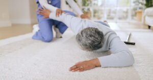 An elderly person falls in nursing home causing TBI