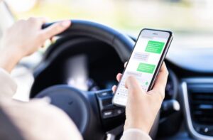 A negligent car driver using mobile while driving