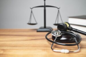 The midsection of the judge's room has a gavel, stethoscope on the desk