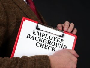 HR manager holds Employee background check report